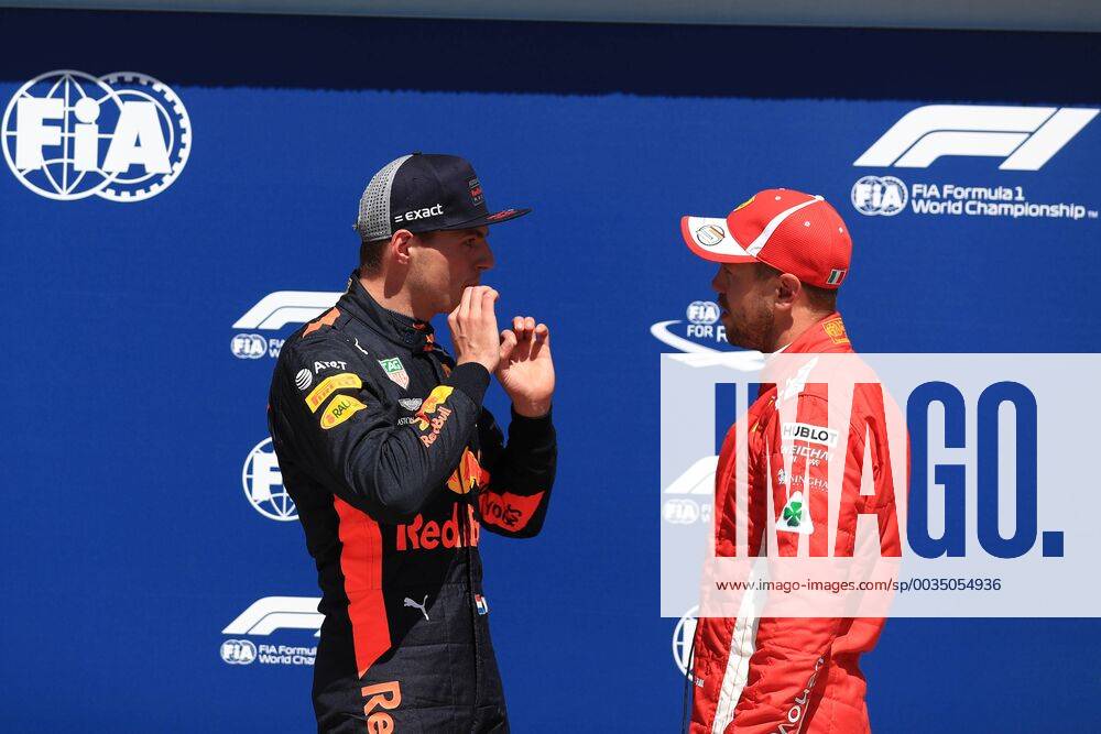9th June 2018, Circuit Gilles-Villeneuve, Montreal, Canada; Canadian Formula One Grand Prix, qualification; Pole sitter Scuderia Ferrari, Sebastian Vettel talks with 3rd placed Red Bull Racing TAG Heuer, Max Verstappen ActionPlus12035025 Octane