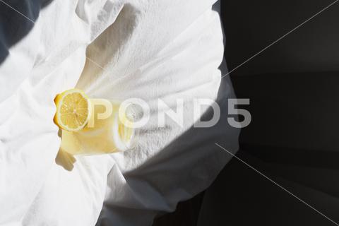 A closeup of a lemon juice with lemons on the bed bed, closeup, lemon, juice, fruit, glass, fresh, food, drink, citrus, cocktail, healthy, yellow, background, sweet, summer, slice, beverage, white, cold, tropical, vitamin, organic, diet