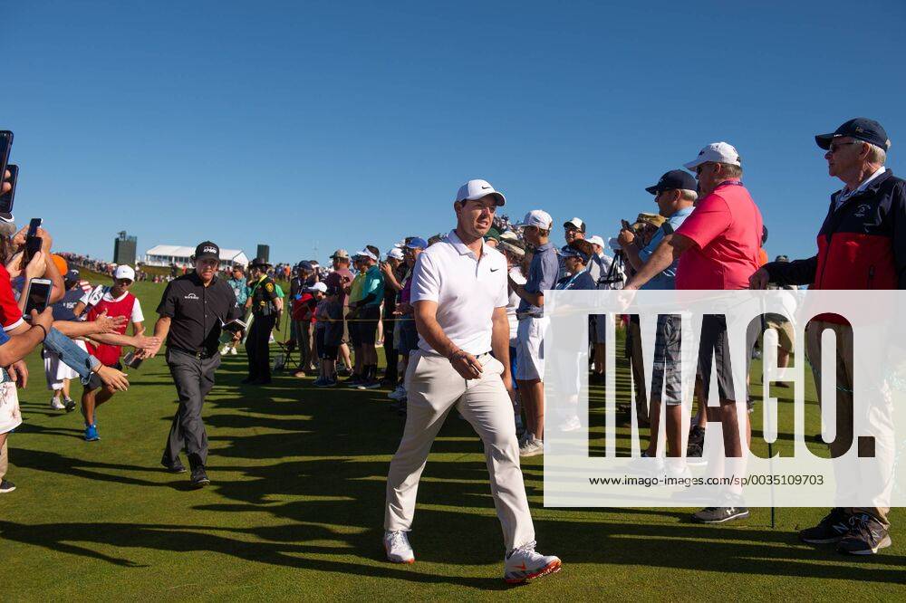 Rory McIlroy from Northern Ireland walks to the 11th tee box with Phil Mickelson behind him in the first round of the 118th U.S. Open Championship at Shinnecock Hills Golf Club in Southampton, New York on June 14, 2018. NYP20180614115 COREYxSIPKIN