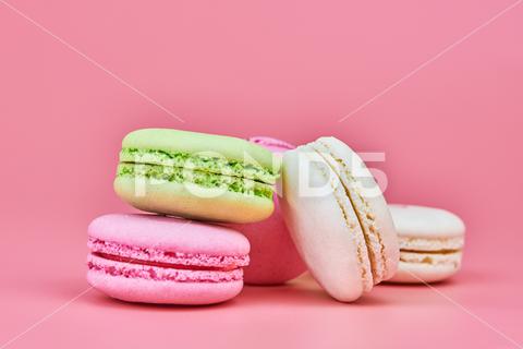 Macaroons on pink background. Colorful small cookie from ground almonds and coconut. Popular confectionery. Tasty snack food for take away, copy space macaroons, macaroon, macaron, pink, colorful, confectionery, cookie, popular, copy space, cake, pastry, cupcake, shortcake, tasty, food, design, snack, take, away, ground, almonds, coconut, small, red, studio, bunch, green, beige, dessert, pastel, different, assorted, cuisine, cafe, vintage, bakery, candy, sweet, french, sandwich, color, desert, sweetness, honey, goody, flavor, gourmet, breakfast, high-calorie, delicious
