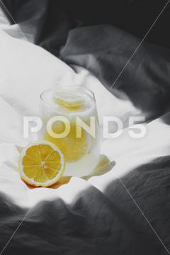 A closeup of a lemon juice with lemons on the bed bed, closeup, lemon, juice, fruit, glass, fresh, food, drink, citrus, cocktail, healthy, yellow, background, sweet, summer, slice, beverage, white, cold, tropical, vitamin, organic, diet