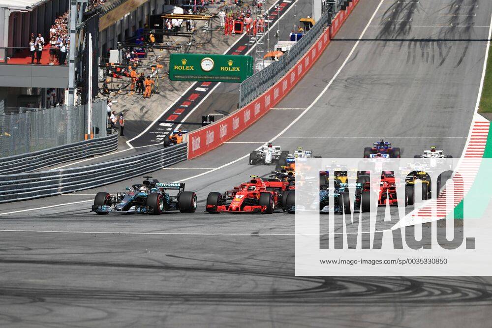 1st July 2018, Red Bull Ring, Spielberg, Austria; Austrian Formula One Grand Prix, Sunday race day; Mercedes AMG Petronas Motorsport, Valtteri Bottas, Lewis Hamilton and Scuderia Ferrari, Kimi Raikkonen go three wide into Turn 1 as Hamilton takes the lead ActionPlus12043164 LeannexBoon