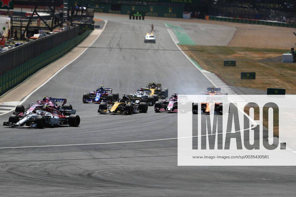 8th July 2018, Silverstone Circuit, Silverstone, England; British Formula One Grand Prix, Race Day; Sahara Force India, Sergio Perez locks up into Turn 1 and comes close to McLaren, Fernando Alonso ActionPlus12045468 Octane