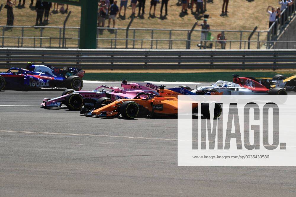8th July 2018, Silverstone Circuit, Silverstone, England; British Formula One Grand Prix, Race Day; Sahara Force India, Sergio Perez locks up into Turn 1 and comes close to McLaren, Fernando Alonso as they go off the racing line ActionPlus12045473 Octane
