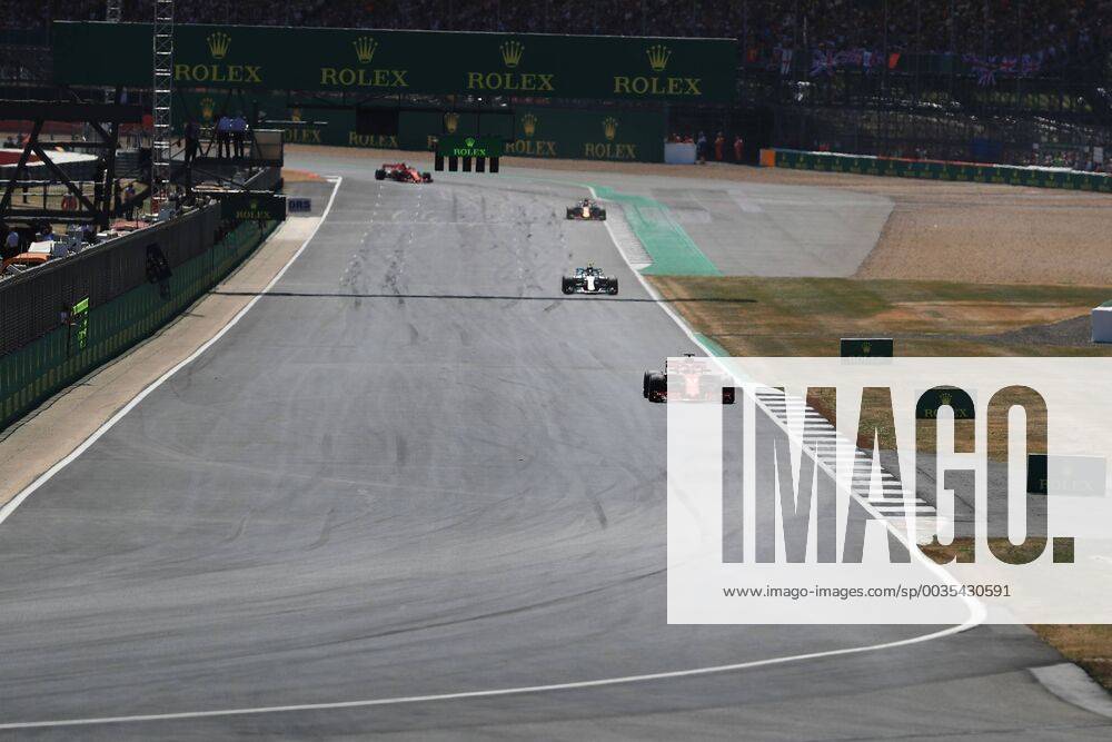 8th July 2018, Silverstone Circuit, Silverstone, England; British Formula One Grand Prix, Race Day; Scuderia Ferrari, Sebastian Vettel leads on lap 2 ahead of Bottas ActionPlus12045478 Octane