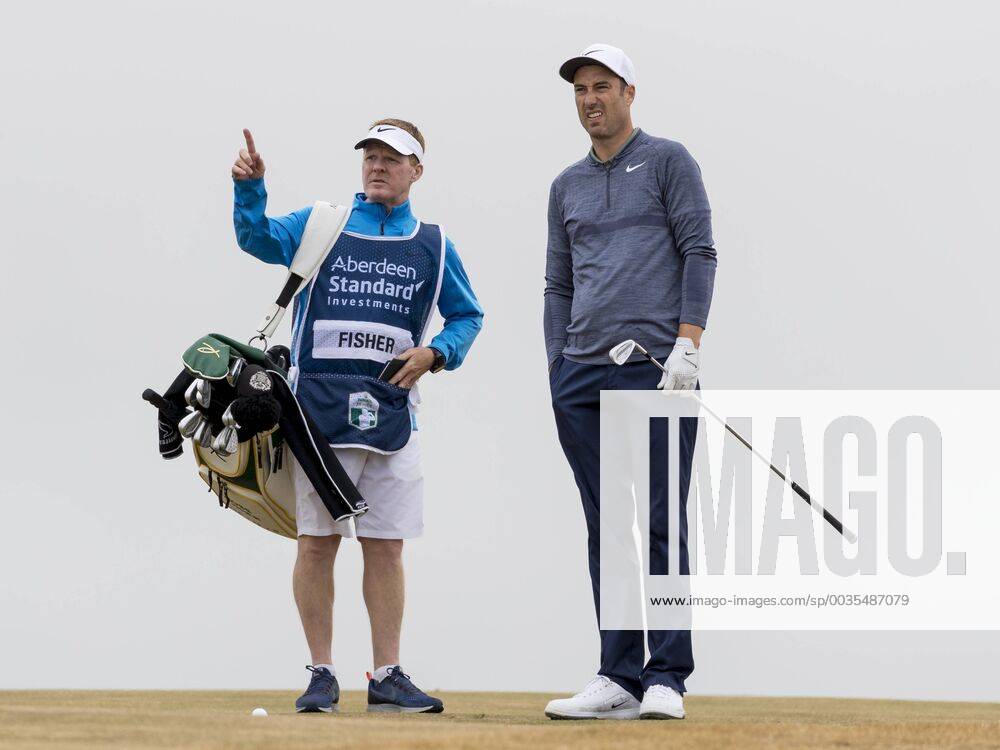 12th July 2018, Gullane Golf Club, Gullane, Scotland; Aberdeen Investments Scottish Open Golf, 1st round; Ross Fisher lines up shot with guidance from his caddy on the 10th fairway ActionPlus12046727 AlanxRennie