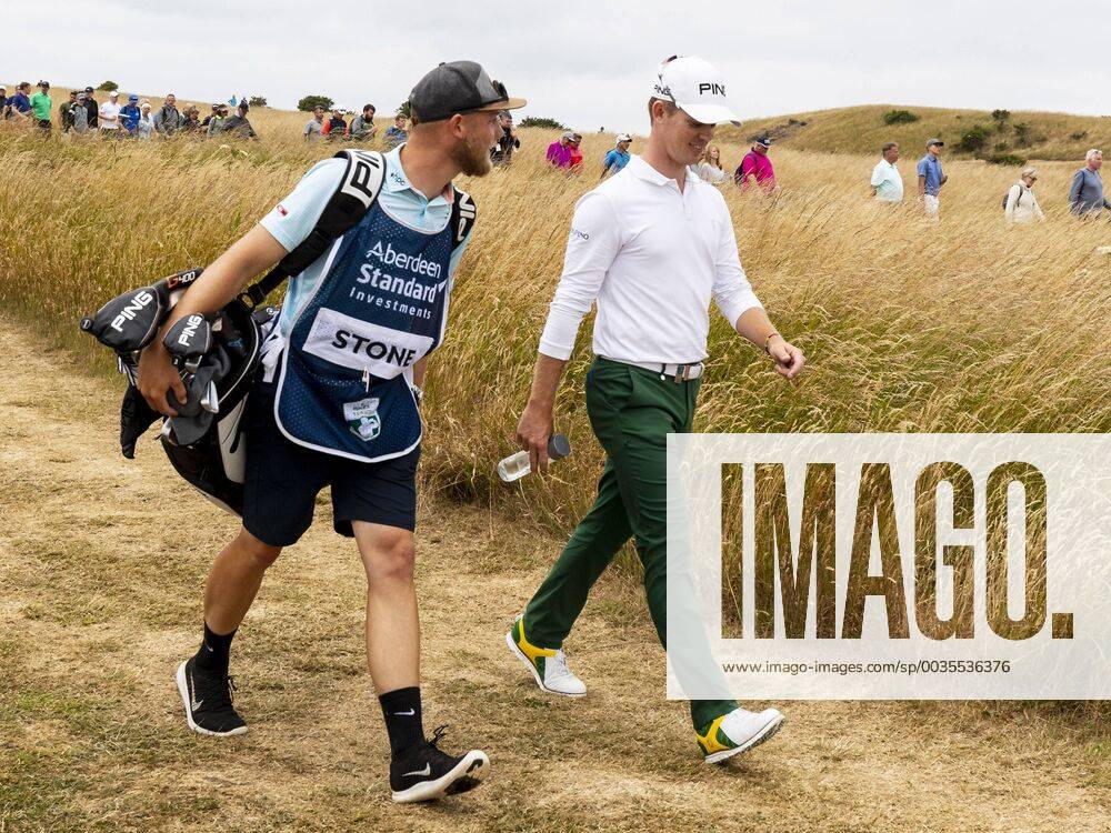 15th July 2018, Gullane Golf Club, Gullane, Scotland; Aberdeen Investments Scottish Open Golf, 4th round; Brandon Stone looking relaxed walking down to the 18th fairway with caddy with a closing round 60 ActionPlus12048159 AlanxRennie