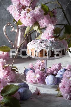 Beautiful Easter cake on the table, and colored eggs, homemade cakes, still life with a silver teapot on a background of pink sakura. High quality photo refined, flower, baking, bloom, branches, cherry, floral, pink, background, cake, decoration, easter, food, holiday, sweet, traditional, dessert, egg, festive, homemade, kulich, religion, rustic, springtime, tradition, celebration, eggs, life, seasonal, still, baked, concept, decor, delicious, design, dough, easter cake, greeting, light, orthodox, orthodox sweet bread, pastry, pie, scene, season, still life, symbol, table