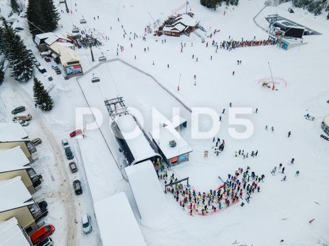 Aerial view jasna ski resort lines to chair lift copy space mountains, travel, aerial, mountain, mount, mountains range, peak, top, drone, overhead, top view, directly above, above, snowboarding, skiing, ski, helmet, goggles, ski goggles, winter, season, sport, activities, extreme, snow, snowing, snowed, white, frost, cold, landscape, scenic, nature, beauty in nature, rural, panoramic, chairlift, chair lift, line, crowd, slovakia, jasna, ski resort, tatra