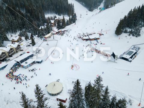 Aerial view jasna ski resort lines to chair lift copy space mountains, travel, aerial, mountain, mount, mountains range, peak, top, drone, overhead, top view, directly above, above, snowboarding, skiing, ski, helmet, goggles, ski goggles, winter, season, sport, activities, extreme, snow, snowing, snowed, white, frost, cold, landscape, scenic, nature, beauty in nature, rural, panoramic, chairlift, chair lift, line, crowd, slovakia, jasna, ski resort, tatra