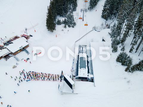 Aerial view jasna ski resort lines to chair lift copy space mountains, travel, aerial, mountain, mount, mountains range, peak, top, drone, overhead, top view, directly above, above, snowboarding, skiing, ski, helmet, goggles, ski goggles, season, sport, activities, extreme, snow, snowing, snowed, white, frost, cold, landscape, scenic, nature, beauty in nature, rural, panoramic, chairlift, chair lift, line, crowd, slovakia, jasna, ski resort, tatra