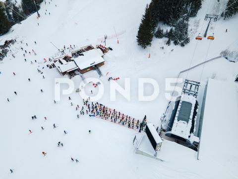 Aerial view jasna ski resort lines to chair lift copy space mountains, travel, aerial, mountain, mount, mountains range, peak, top, drone, overhead, top view, directly above, above, snowboarding, skiing, ski, helmet, goggles, ski goggles, season, sport, activities, extreme, snow, snowing, snowed, white, frost, cold, landscape, scenic, nature, beauty in nature, rural, panoramic, chairlift, chair lift, line, crowd, slovakia, jasna, ski resort, tatra