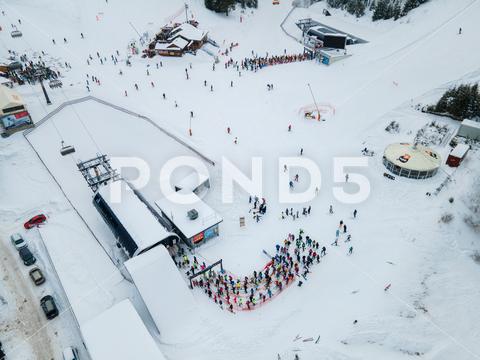 Aerial view jasna ski resort lines to chair lift copy space mountains, travel, aerial, mountain, mount, mountains range, peak, top, drone, overhead, top view, directly above, above, snowboarding, skiing, ski, helmet, goggles, ski goggles, season, sport, activities, extreme, snow, snowing, snowed, white, frost, cold, landscape, scenic, nature, beauty in nature, rural, panoramic, chairlift, chair lift, line, crowd, slovakia, jasna, ski resort, tatra