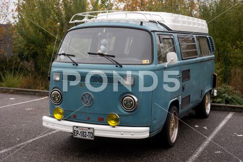 Mulhouse - France - 13 November 2022 - Front view of blue Volkswagen van parked in the street volkswagen, van, vw, blue, adventure, aged, antique, auto, automobile, automotive, brand, bus, camper, car, classic, design, emblem, europe, freedom, front, german, germany, history, logo, minivan, model, motor, old, outdoor, parked, retro, road, rustic, sign, street, style, symbol, tourist, transport, transporter, travel, truck, urban, vacation, vehicle, vintage, volkswagen camper, volkswagen van