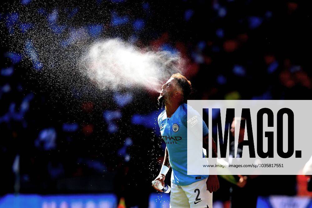 KW31 5th August 2018, Wembley Stadium, London, England; FA Community Shield, Chelsea versus Manchester City; Kyle Walker of Manchester City sprays water out of his mouth ActionPlus12053337 ShaunxBrooks