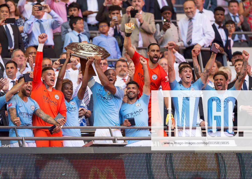 Vincent Kompany of Manchester City and Fernandinho of Manchester City lift the FA Community Shield during the The FA Community Shield Final match between Chelsea and Manchester City at Stamford Bridge, London, England on 5 August 2018.