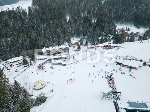 Aerial view jasna ski resort lines to chair lift copy space mountains, travel, aerial, mountain, mount, mountains range, peak, top, drone, overhead, top view, directly above, above, snowboarding, skiing, ski, helmet, goggles, ski goggles, season, sport, activities, extreme, snow, snowing, snowed, white, frost, cold, landscape, scenic, nature, beauty in nature, rural, panoramic, chairlift, chair lift, line, crowd, slovakia, jasna, ski resort, tatra