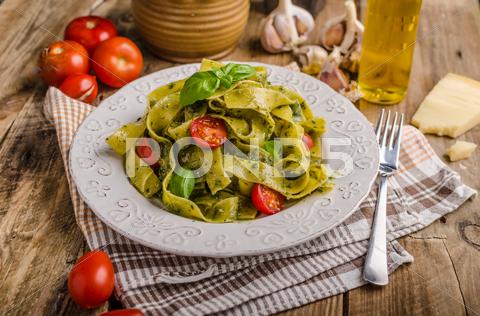 Pasta with basil pesto, very simple and delicious. Pesto from olive oil, basil, nuts and parmasan pasta, pesto, food, basil, sauce, italian, green, spaghetti, plate, healthy, spinach, tagliatelle, white, dish, cheese, cuisine, meal, cooking, herb, tasty, traditional, italy, gourmet, dinner, lunch, restaurant, oil, parmesan, fresh, background, eating, leaf, fettuccine, homemade, diet, garlic, vegetarian, closeup, vegetable, photography, mediterranean, parmesan, parmasan, milan pesto, olive oil, bio, organic, domestic, wood, napkin