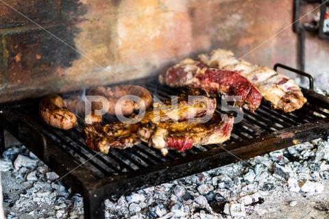 The traditional and most famous argentinian barbecue steak, grill, fire, smoke, fat, grilling, argentinian, barbecue, beef, meat, sausage, cooking, fresh, bar-b-q, authentic, close up, gas, grid, heat, original, outside, strip, york, argentina, restaurant, ribs, ashes, barbeque, coal, hot, kitchen, new, protein, roast, sirloin, beefsteak, broiler, dark, eating, grilled, lunch, meal, orange, outdoors, roasted, chorizo, closeup, cook, cooked, córdoba, cordoba, no people