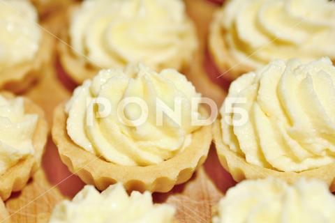 Closeup of cupcakes filled with vanilla cream. cream, cupcake, dessert, vanilla, cake, snack, background, food, cup, sweet, butter, confectionery, baked, celebration, delicious, swirl, birthday, decorating, decoration, epicure, treat, creamy, decorated, homemade, party, unhealthy, bakery, bakery goods, confection, cool, dairy, holiday, pudding, soft, twirl, buttercream, celebrate, fancy, nobody, cupcakes, frosting, icing
