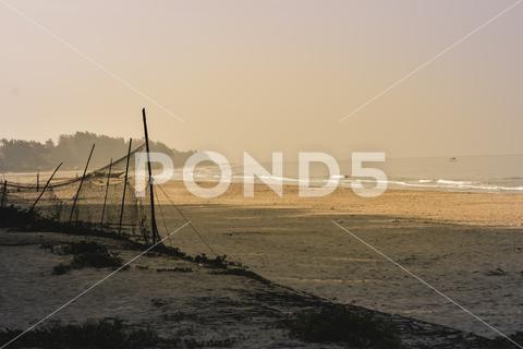 Panorama landscape view of a beautiful tropical sea beach in sunset time during christmas holiday. ( MUMBAI, MAHARASTRA, INDIA). Travel vacation and holiday concept. silhouette, vacation, sunrise, resort, summer, sun, sky, paradise, palm-tree, travel, coconut, orange, nature, exotic, dusk, trees, yellow, island, ocean, evening, background, light, twilight, sunlight, scenery, tranquil, scene, water, leaf, sundown, golden, caribbean, maldives, tropic, coastal-sand, thailand, holiday, colorful, shore-coast, asia, lagoon, miami, hawaii, islands, bali, morning, lucia, bahamas, jamaica, wave