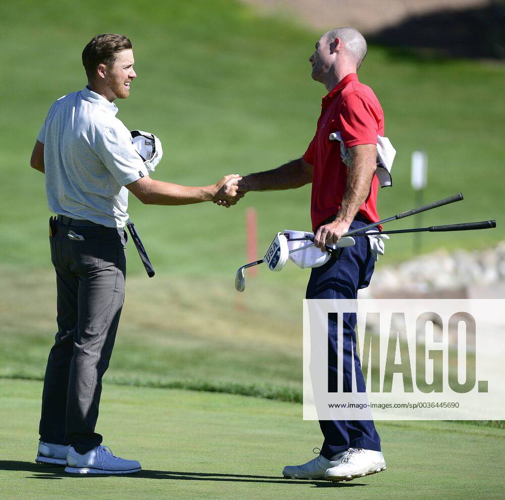 Albuquerque, NEW MEXICO, U.S. - 091318 .Sam Saunders,<cq>,left is congratulated by 2nd place finisher Jeff Burton,<cq>., after hitting the winning shot in the Final Round of the New Mexico Open held at Sandia Golf Course .Photographed on Thursday September 13, 2018 Journal News - September 13, 2018 - ZUMAab1_ 85445269st