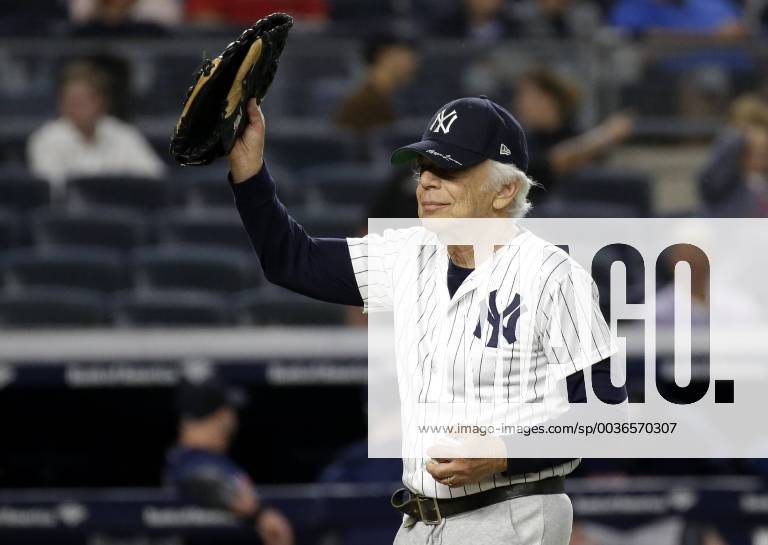 KW38 Designer Ralph Lauren raises his glove on the field after throwing out the first pitch before the New York Yankees play the Boston Red Sox at Yankee Stadium in New York City on September 20, 2018. NYP20180920107 JOHNxANGELILLO