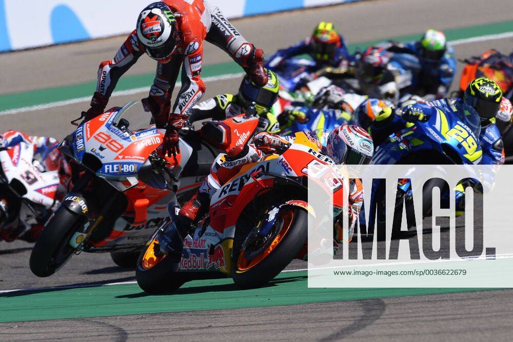 KW38 Marc Marquez (93) of Spain and Repsol Honda Team and crash of Jorge Lorenzo (99) of Spain and Ducati Team during race day of the Gran Premio Movistar de Aragon of World Championship WM Weltmeisterschaft of MotoGP at Motorland Aragon Circuit on September 23, 2018 in Alcaniz, Spain.