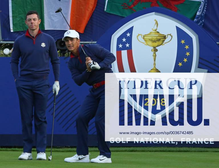 Rory McIlroy (L) and Thorbjorn Olesen arrive on the first tee before the start of the Ryder Cup at Le Golf National in Guyancourt near Paris on September 28, 2018. PAR20180929104 DAVIDxSILPA