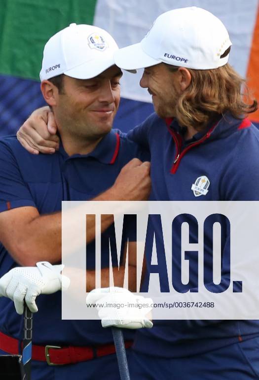 Francesco Molinari (L) and Tommy Fleetwood arrive on the first tee before the start of the Ryder Cup at Le Golf National in Guyancourt near Paris on September 28, 2018. PAR20180929109 DAVIDxSILPA