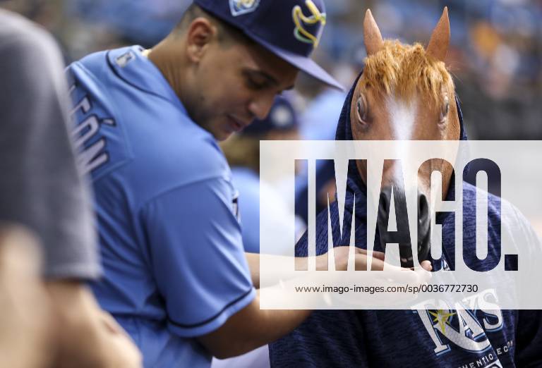 St. Petersburg, Florida, U.S. - MONICA HERNDON Times.Tampa Bay Rays right fielder Carlos Gomez (27) wears a horse mask as pitcher Jose De Leon feeds him seeds during the Tampa Bay Rays game against the Toronto Blue Jays on September 30, 2018 at Tropicana Field in St. Petersburg, Fla. Florida News - September 30, 2018 - ZUMAs70_ 85793613st