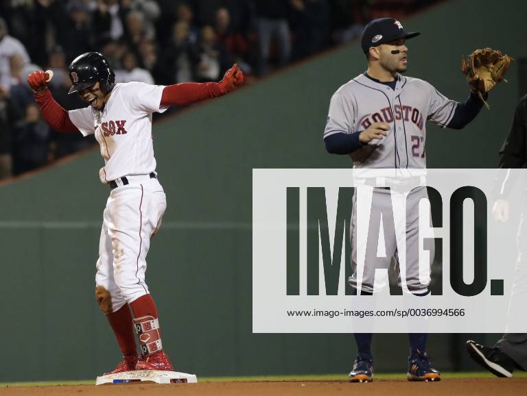 KW41 Boston Red Sox Mookie Betts (R) celebrates after doubling home a run against Houston Astros second baseman Jose Altuve during the eighth inning in game two of the American League Championship Series at Fenway Park in Boston, Massachusetts on October 14, 2018. The Astros hold a 1-0 series lead over the Red Sox. BOS2018101441 JOHNxANGELILLO