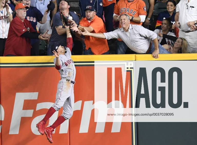 KW42 Fans interfere with Boston Red Sox right fielder Mookie Betts (50) as he attempts to field a pop by Houston Astros designated hitter Jose Altuve, who was called out during the second inning in game four of the American League Championship Series at Minute Maid Park in Houston, Texas, October 17, 2018. HSP20181017204 TRASKxSMITH