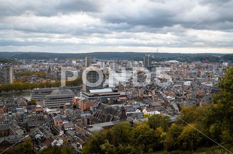 A landscape view over the center of Liege city, Belgium architecture background belgium buildings center city cityscape cloudy daylight green industial landmark landscape liege mountains skyline traditional travel trees urban view white