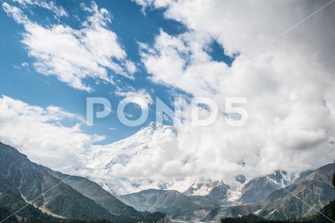 The Fairy Meadows Nanga Parbat mountains with a cloudy blue sky in the background, Pakistan adventure background beautiful blue cloudy destination discover explore extreme fairy meadows gilgit-baltistan hiking landmark location mountains nanga parbat nature pakistan peaks place scenic see site sky travel trekking view visit wallpaper