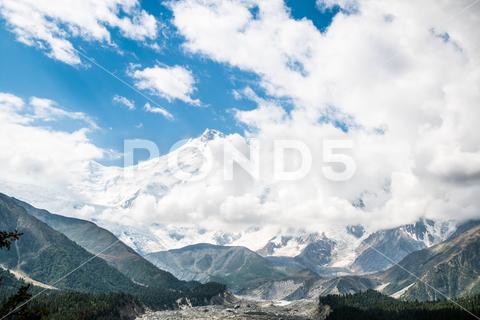 The Fairy Meadows Nanga Parbat mountains with a cloudy blue sky in the background, Pakistan adventure background beautiful blue cloudy destination discover explore extreme fairy meadows gilgit-baltistan hiking landmark location mountains nanga parbat nature pakistan peaks place scenic see site sky travel trekking view visit wallpaper