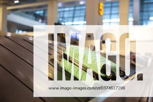 The luggage belt with suitcases being delivered to the passengers at the arrival terminal 22226013 RECORD DATE NOT STATED