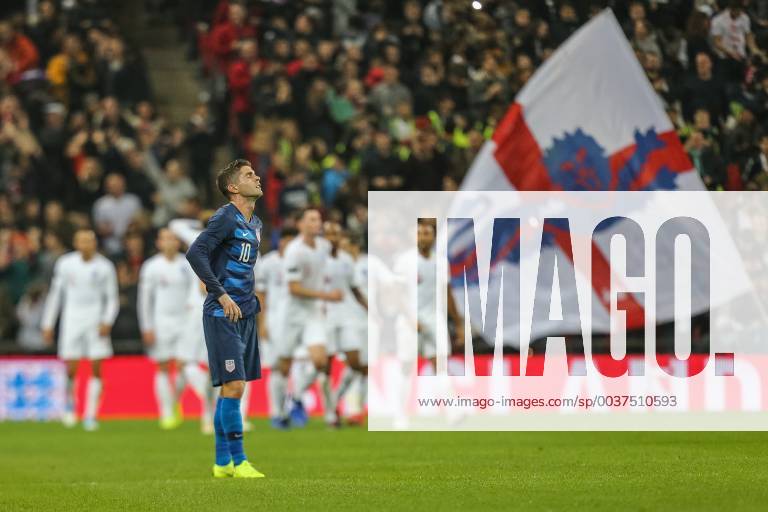 Christian Pulisic (Borussia Dortmund) of United States looks dejected as England players celebrate the opening goal during the WR Foundation international match L?nderspiel between England and USA at Wembley Stadium, London, England on 15 November 2018.