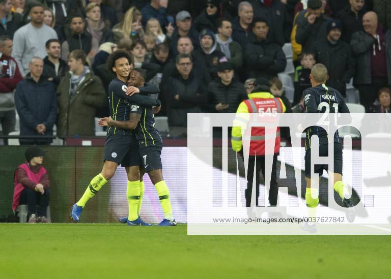 Raheem Sterling of Manchester City celebrates scoring with Leroy San? of Manchester City during the Premier League match between West Ham United and Manchester City at the Olympic Park, London, England on 24 November 2018.