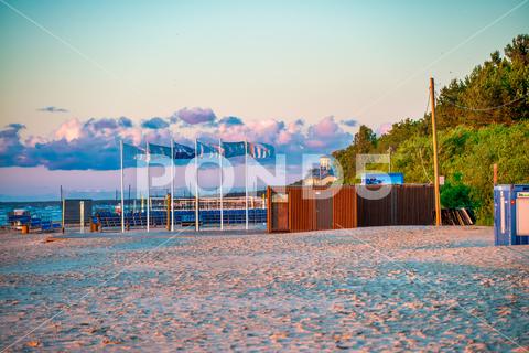 Jurmala Beach at sunset. summer outdoors nature jurmala vacations sand cultures wood famous place material blue tourism water travel tourist landscape coastline day transportation travel destinations sunlight season tourist resort nautical vessel sunset beauty in nature relaxation sun tropical climate yacht idyllic multi colored yellow seascape sailboat wave cloud sailing dusk tranquil scene sky no people leisure activity sport journey sailing ship caribbean recreational pursuit commercial dock