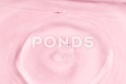 Close up of water drop falling into water with ripples and copy space on pink background. Water, liquid and colour concept. No People Close Water Drop Falling Water Ripple Copy Space Pink Background Liquid Colour Concept Drop Splash Abstract Design Background Wet Flow Fluid Closeup Wave Illustration Macro Business Graphic Symbol Isolated Flowing Color Clean Drink Water Falling Copy Space Pink