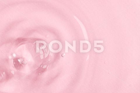Close up of water drop falling into water with ripples and copy space on pink background. Water, liquid and colour concept. No People Close Water Drop Falling Water Ripple Copy Space Pink Background Liquid Colour Concept Drop Splash Abstract Design Background Wet Flow Fluid Closeup Wave Illustration Macro Business Graphic Symbol Isolated Flowing Color Clean Drink Water Falling Copy Space Pink