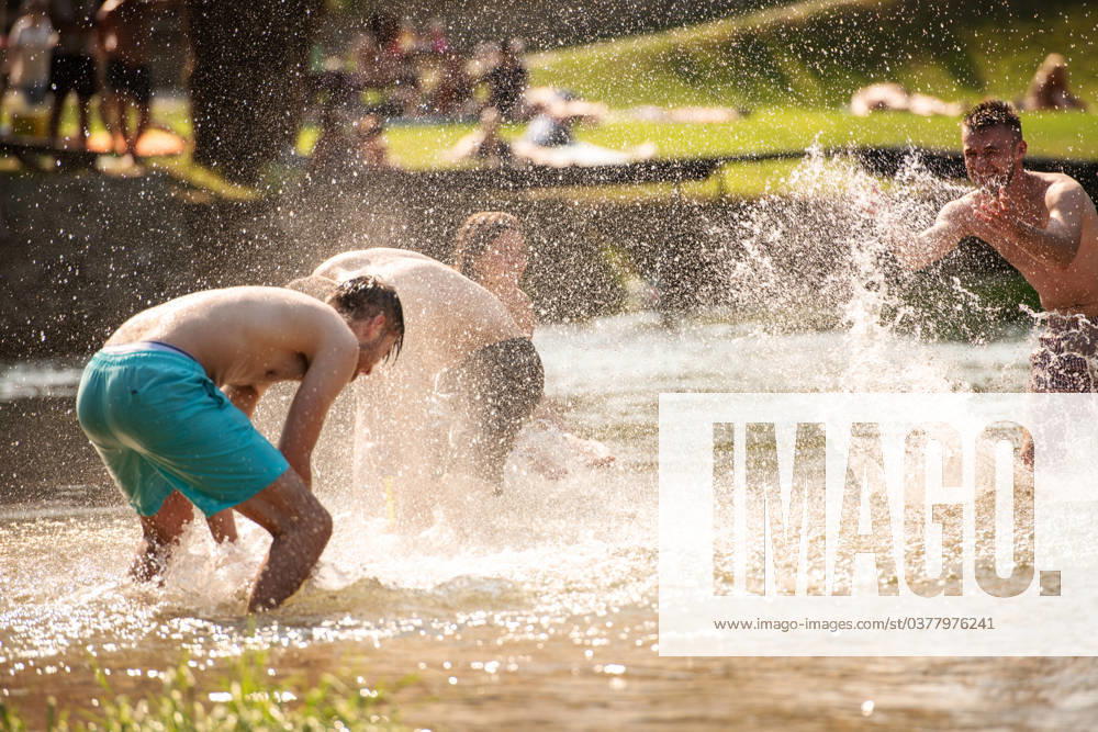 Summer joy friends having fun on river summer joy group of happy friends having fun while running and splashing on river ,model released, Symbolfoto