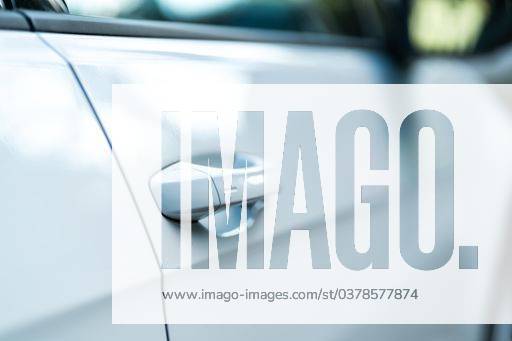 Closeup of a bright car door. Concept for a modern car. Perfect to illustrate new mobility, car purchase or electric vehicles. 366010 RECORD DATE NOT STATED