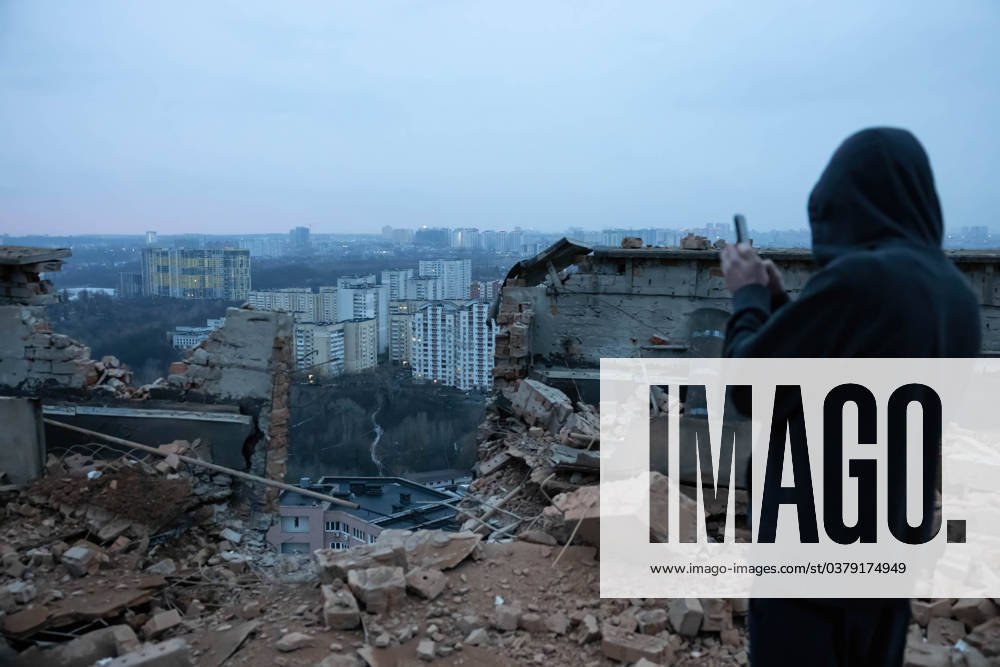 Russian drone attack on residential building in Kyiv, Ukraine - 22 Dec 2023 A man shoots a video with his phone of the damages at the site of a drone attack on a residential building in Kyiv. At least two people were injured after a Russian drone attack hit a residential building in Kyiv, for the third time.Russia s Shahed type drone hit a residential building in the Ukrainian capital. Kyiv Ukraine