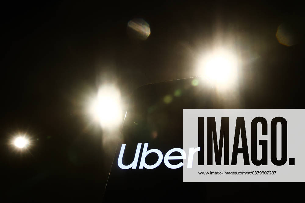 Popular Apps And IT Companies Photo Illustrations Lights and Uber logo displayed on a phone screen are seen in this illustration photo taken in Krakow, Poland on December 27, 2023. Krakow Poland