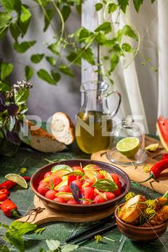 Spicy salad of fresh watermelon balls with basil, lime, rosemary and fennel, topping with olive oil on dark green table surface with sunny light watermelon vegetable summer food healthy salad basil lime rosemary freshness delicious cheese melon table organic epicure vegetarian plate fruit dinner meal sweet green diet red lunch fresh leaf juicy ripe snack herb closeup rustic overhead nourishment eating dish cookery