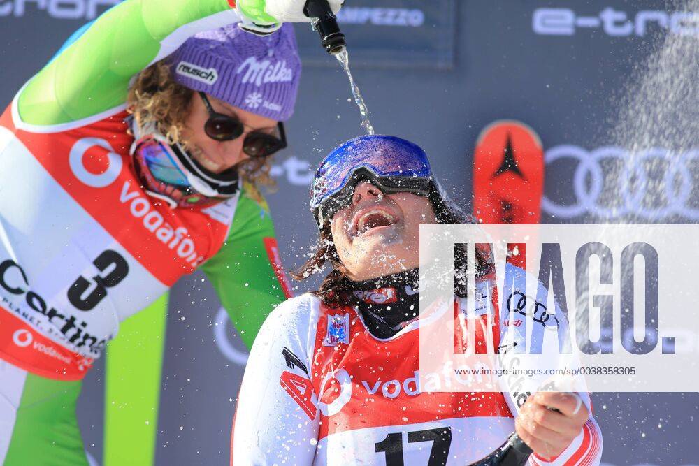 KW03 18th January 2019, Cortina D Ampezzo, Italy; FIS Ski World Cup, ladies downhill; Ilka Stuhec (SLO) plays with Proseco and Ramona Siebenhofer (AUT) on the winners podium ActionPlus12096876 PierrexTeyssot