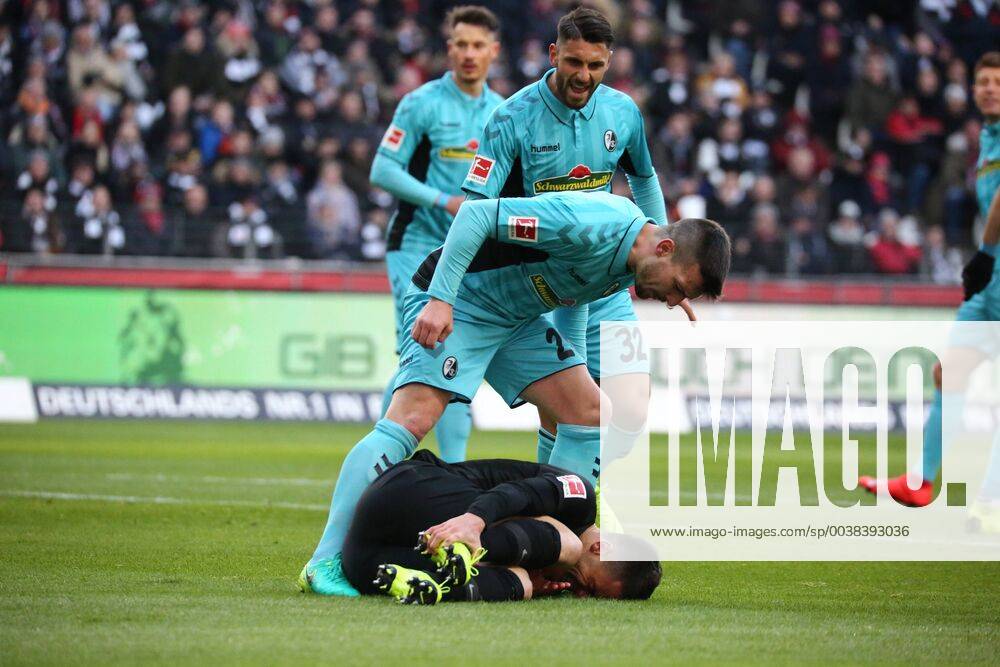 KW03 Jerome Gondorf (SC Freiburg) und Vincenzo Grifo (SC Freiburg) schreien den am Boden liegenden Filip Kostic (Frankfurt) an, weil sie ein Schauspiel vermuten beim Spiel Eintracht Frankfurt vs. SC Freiburg in der 1. Fussball Bundesliga am 19.01.2019. DFL REGULATIONS PROHIBIT ANY USE OF PHOTOGRAPHS AS IMAGE SEQUENCES AND OR QUASI-VIDEO Eintracht Frankfurt vs. SC Freiburg, Fussball, 1. Bundesliga, 19.01.2019 Frankfurt