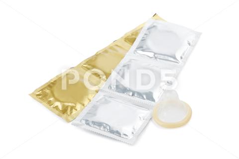 Unpacked condom and packages on white background. Safe sex aids background barrier birth care color condom condoms contraception contraceptive control disease education health healthy hiv illness infection isolated latex lifestyle male many medical medicine object packaged packages pharmacy pregnancy prevention protect protection risk rubber safe safety security sex sexual silver std sti unpacked unwrapped venereal virus white